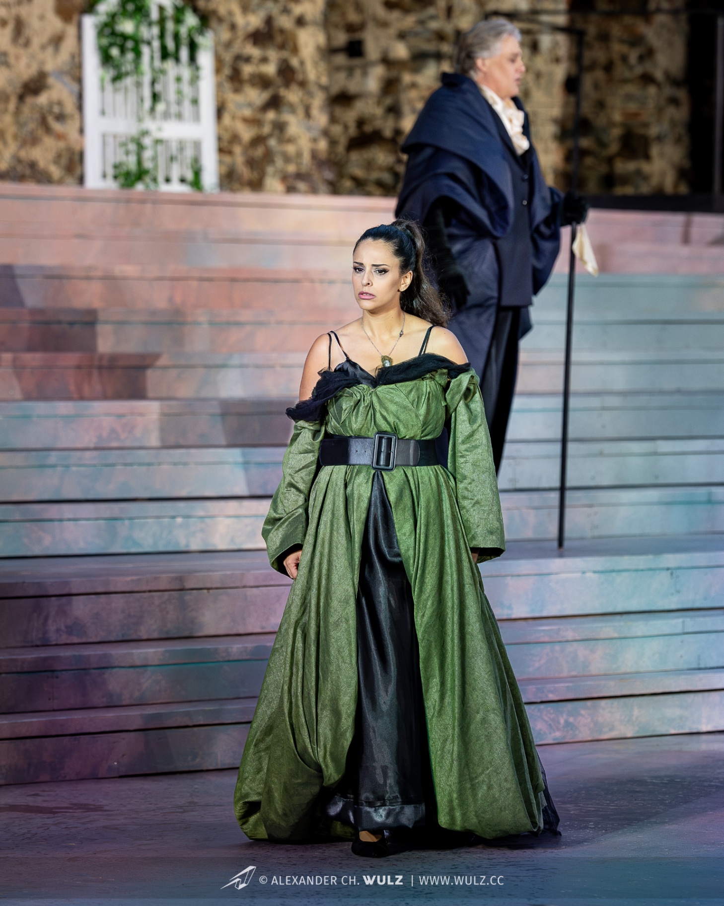 Hila Fahima as Violetta in La traviata, Oper Burg Gars 2025 — in an olive gown as Germont looks on, photo by Alexander Wulz